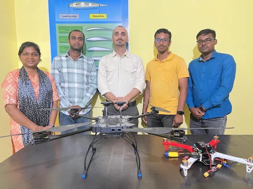 The Aeropioneer Institutes team with a heavy-lift agricultural drone at the training facility